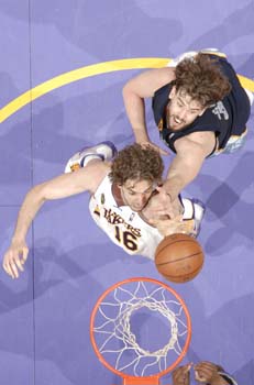 LOS ANGELES - MARCH 3:  Pau Gasol #16 of the Los Angeles Lakers puts up a shot against Marc Gasol #33 of the Memphis Grizzlies at Staples Center on March 3, 2009 in Los Angeles, California. NOTE TO USER: User expressly acknowledges and agrees that, by downloading and/or using this Photograph, user is consenting to the terms and conditions of the Getty Images License Agreement. Mandatory Copyright Notice: Copyright 2009 NBAE (Photo by Andrew D. Bernstein/NBAE via Getty Images)