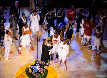 PHOENIX - FEBRUARY 15:  TNT's Ernie Johnson interviewd Shaquille O'Neal and Kobe Bryant of the Western Conference after they were named as co-MVP's of the game against the Eastern Conference as O'Neal and Bryant embrace during the 58th NBA All-Star Game, part of 2009 NBA All-Star Weekend, at US Airways Center on February 15, 2009 in Phoenix, Arizona.  NOTE TO USER: User expressly acknowledges and agrees that, by downloading and or using this photograph, User is consenting to the terms and conditions of the Getty Images License Agreement.  Mandatory Copyright Notice:  Copyright 2009 NBAE  (Photo by Juan Ocampo/NBAE/Getty Images)